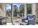 Cozy back porch with views of pond and landscaping, accessible through sliding glass doors at 6624 Lagoon Pl., Myrtle Beach, SC 29572