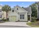 Charming light green single Gathering home with a well-manicured lawn and a one car garage at 6624 Lagoon Pl., Myrtle Beach, SC 29572