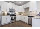 Charming kitchen with stainless steel appliances, tile backsplash, and granite countertops at 6624 Lagoon Pl., Myrtle Beach, SC 29572