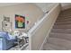 Cozy living room with comfortable seating, an accent chair, and a well-lit staircase at 6624 Lagoon Pl., Myrtle Beach, SC 29572