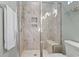 Modern shower with dual showerheads, a built-in seat, and decorative tiling for a spa-like experience at 6624 Lagoon Pl., Myrtle Beach, SC 29572