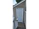 Side view of back door entryway, framed by siding, up steps from patio area at 6702 Jefferson Jefferson Pl. # F2, Myrtle Beach, SC 29572