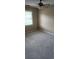 Bedroom featuring neutral carpet, a ceiling fan, and a bright window at 6702 Jefferson Jefferson Pl. # F2, Myrtle Beach, SC 29572