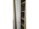 Built-in closet with louvered door and adjustable shelves, offering versatile storage solutions at 6702 Jefferson Jefferson Pl. # F2, Myrtle Beach, SC 29572
