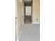 Hallway featuring neutral carpet, beige walls, and tiled flooring leading to other rooms at 6702 Jefferson Jefferson Pl. # F2, Myrtle Beach, SC 29572