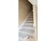 Carpeted staircase with a white handrail, leading to the upper level of the home at 6702 Jefferson Jefferson Pl. # F2, Myrtle Beach, SC 29572