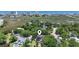 Serene aerial view showcases the home's location near marshland and a distant coastal skyline at 709 Triple Oak Ln., Garden City Beach, SC 29576