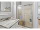 The bathroom features a sink with a granite countertop and a sliding door shower stall at 709 Triple Oak Ln., Garden City Beach, SC 29576