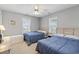 Inviting bedroom with two twin beds, bright windows, neutral walls, and classic furnishings at 709 Triple Oak Ln., Garden City Beach, SC 29576