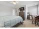 Comfortable bedroom with natural light featuring a TV on a wooden dresser and neutral decor for a relaxing space at 709 Triple Oak Ln., Garden City Beach, SC 29576