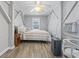 Cozy bedroom featuring a bed, natural light, unique architectural elements, and comfortable furnishings at 709 Triple Oak Ln., Garden City Beach, SC 29576