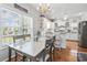 Inviting dining area with lots of natural light, a chandelier, and an open kitchen in view at 709 Triple Oak Ln., Garden City Beach, SC 29576