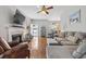 Spacious living room with hardwood floors, a fireplace, comfortable seating, and open layout at 709 Triple Oak Ln., Garden City Beach, SC 29576