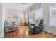 Bright living room features hardwood floors, neutral decor, and comfortable seating arrangement at 709 Triple Oak Ln., Garden City Beach, SC 29576