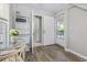 Functional mud room with outside access, storage shelves, bright interior, and easy access to other rooms at 709 Triple Oak Ln., Garden City Beach, SC 29576