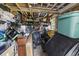 Overstuffed storage area with disorganized shelves and tools, presenting an opportunity for efficient organization at 709 Triple Oak Ln., Garden City Beach, SC 29576