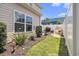 Landscaped backyard features a grill, a white fence and outdoor seating at 800 Monarch Dr. # 49, Myrtle Beach, SC 29588