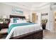 Comfortable bedroom with tray ceiling, decorative pillows and neutral decor at 800 Monarch Dr. # 49, Myrtle Beach, SC 29588