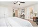Spacious bedroom with ensuite bathroom featuring neutral walls and an overhead fan at 800 Monarch Dr. # 49, Myrtle Beach, SC 29588