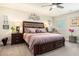 Relaxing bedroom with a dark wood bed frame and soft, carpeted floors at 800 Monarch Dr. # 49, Myrtle Beach, SC 29588