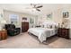 Bright bedroom featuring a plush recliner, patterned bedding, and neutral decor for a relaxing retreat at 800 Monarch Dr. # 49, Myrtle Beach, SC 29588