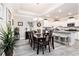 Elegant dining area open to the kitchen, featuring modern light fixtures and ample seating at 800 Monarch Dr. # 49, Myrtle Beach, SC 29588