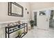 Bright foyer featuring a console table, mirror, and a glimpse of the front door at 800 Monarch Dr. # 49, Myrtle Beach, SC 29588