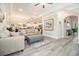 Open-concept living room featuring modern furniture, hardwood floors, and view to kitchen at 800 Monarch Dr. # 49, Myrtle Beach, SC 29588