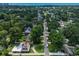 This aerial view shows a house in a neighborhood that is tree covered near the coast at 804 47Th Ave. N, Myrtle Beach, SC 29577