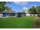 This home has a charming backyard with lush green grass and a white fence at 804 47Th Ave. N, Myrtle Beach, SC 29577