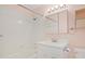 Bright bathroom featuring a white vanity, medicine cabinet, and tiled shower-tub combo at 804 47Th Ave. N, Myrtle Beach, SC 29577