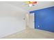 Bedroom with neutral carpet, colorful fan, and white door with blue wall accent at 804 47Th Ave. N, Myrtle Beach, SC 29577