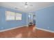 Bedroom features wood floors, ceiling fan, natural light from windows, and a vanity area, creating a functional space at 804 47Th Ave. N, Myrtle Beach, SC 29577