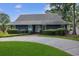 Charming one-story home featuring a circular driveway and well-manicured landscaping at 804 47Th Ave. N, Myrtle Beach, SC 29577