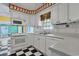 Bright kitchen featuring white appliances and a view to the living room at 804 47Th Ave. N, Myrtle Beach, SC 29577