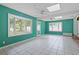 Bright living room featuring tile floors, ceiling fans, and large windows at 804 47Th Ave. N, Myrtle Beach, SC 29577