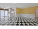 Bright living room featuring black and white checkered floors and archways to other rooms at 804 47Th Ave. N, Myrtle Beach, SC 29577