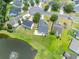 Aerial view of home with backyard patio overlooking a pond with a fountain in a picturesque neighborhood at 805 Cherry Bark Ct., Myrtle Beach, SC 29579