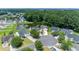 Aerial view of homes in a cul-de-sac, surrounded by trees, showcasing the community's serene and private location at 805 Cherry Bark Ct., Myrtle Beach, SC 29579
