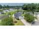 Aerial view showcasing a well-maintained home with a pond, complemented by a lush, green landscape at 805 Cherry Bark Ct., Myrtle Beach, SC 29579