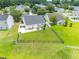 Aerial view of a large, fenced backyard with patio furniture and a barbecue grill perfect for outdoor entertaining at 805 Cherry Bark Ct., Myrtle Beach, SC 29579
