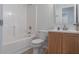 Well-lit bathroom featuring a shower-tub combo, toilet, and stylish vanity with wooden cabinets at 805 Cherry Bark Ct., Myrtle Beach, SC 29579