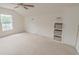 Expansive bedroom with a ceiling fan, plush carpeting, and built-in shelving for ample storage at 805 Cherry Bark Ct., Myrtle Beach, SC 29579