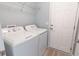 Well-lit laundry room with modern washer and dryer setup, complemented by convenient shelving at 805 Cherry Bark Ct., Myrtle Beach, SC 29579