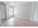 Bright room with sleek modern floors, a window, and neutral paint providing a canvas for personalization at 805 Cherry Bark Ct., Myrtle Beach, SC 29579