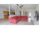 Spacious living room boasts modern floors, a ceiling fan, and seamlessly connects to the adjacent kitchen at 805 Cherry Bark Ct., Myrtle Beach, SC 29579