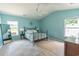 Spacious main bedroom features neutral colors, vaulted ceiling, modern fan and two windows at 805 Cherry Bark Ct., Myrtle Beach, SC 29579