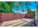 Outdoor back deck area featuring a wood privacy fence and a partially weathered wooden deck at 808 Myrtle Ct. # 808, North Myrtle Beach, SC 29582