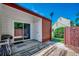 Backyard patio featuring a wooden deck, red fencing and a sliding glass door at 808 Myrtle Ct. # 808, North Myrtle Beach, SC 29582