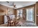 Cozy dining room featuring a glass table, white buffet, and large window with natural light at 808 Myrtle Ct. # 808, North Myrtle Beach, SC 29582